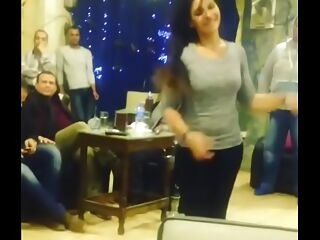arab girl dancing with mates in cafe